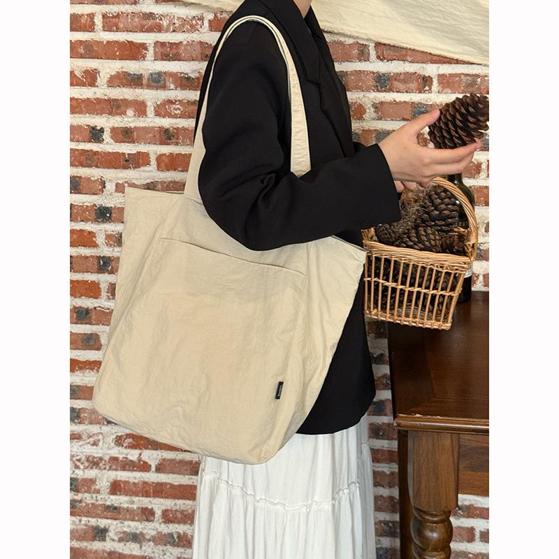 Korean simple solid color canvas bag women's 2025 new large-capacity lightweight shoulder tote bag versatile commuter bag