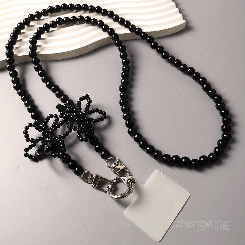 

Crossbody pearl petal mobile phone lanyard women s ins shopping fashion small fragrant style long mobile phone lanyard strap chain [classic black]