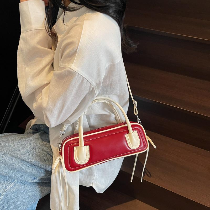 Korean version of fashionable textured portable bowling bag women's 2025 new trend versatile contrasting color baguette underarm women's bag