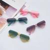 2026 New Children's Fashion Frameless Irregular Personality Trend Dopamine Color Ocean Lens Sunglasses