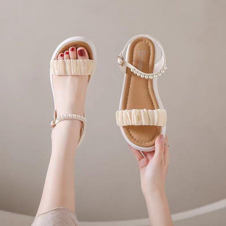 

Stepping on shit thick-soled slippers female summer flat bottom 2025 new small fragrant wind Roman beach sandals female fairy wind outside wear 40