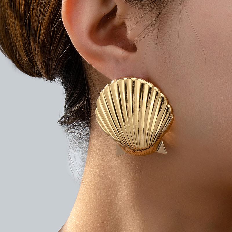 

Trendy Shell Element Earrings: European & American Inspired Metallic Studs