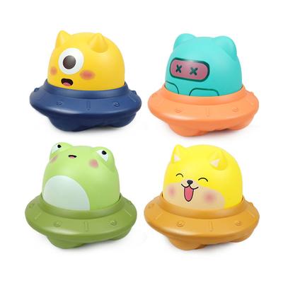 Naciśnięcie latającego spodka kosmicznego Naciśnięcie bezwładnościowego przesuwanego słodkiego kreskówkowego zabawki, może być używane jako prezent do interakcji rodzic-dziecko