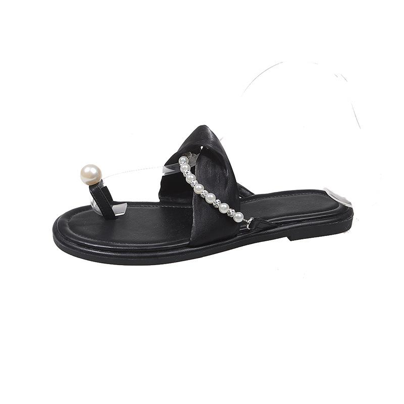 

2025 summer new round-toed muffin, seaside beach platform slippers, a woman wearing a pair of pearl sandals 40