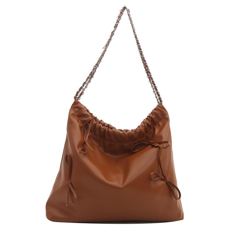 

Large-capacity bag women s 2025 new simple and versatile chain shoulder bag texture bucket class commuter tote bag коричневый