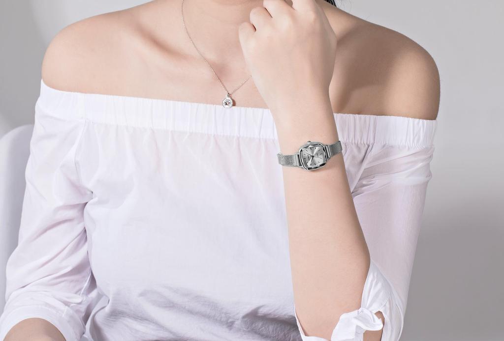 waterproof watch with a thin silver mesh strap and fashionable quartz Women's small, simple, movement.