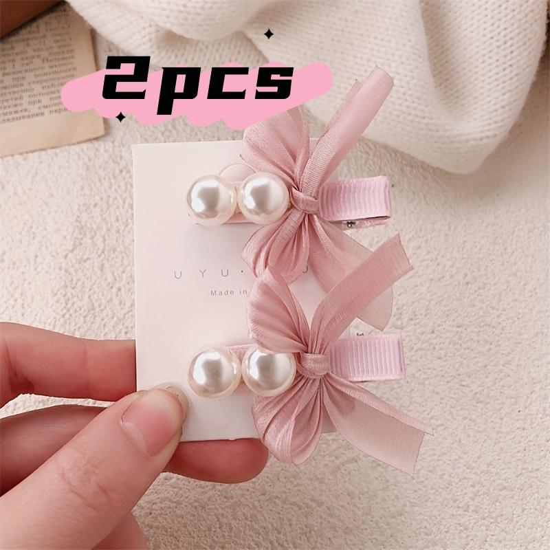 

Two elegant bow hair clips, adorned with lace and pearls, suitable for all seasons and perfect for girls weddings, parties, dan One Size