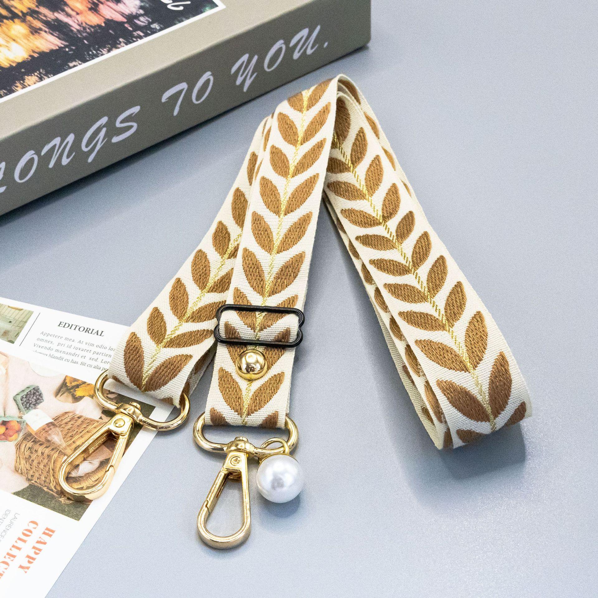 

Maple Leaf Phone Lanyard: Adjustable Crossbody Chain with Pearl Charm - Anti-Lost and Sturdy Design