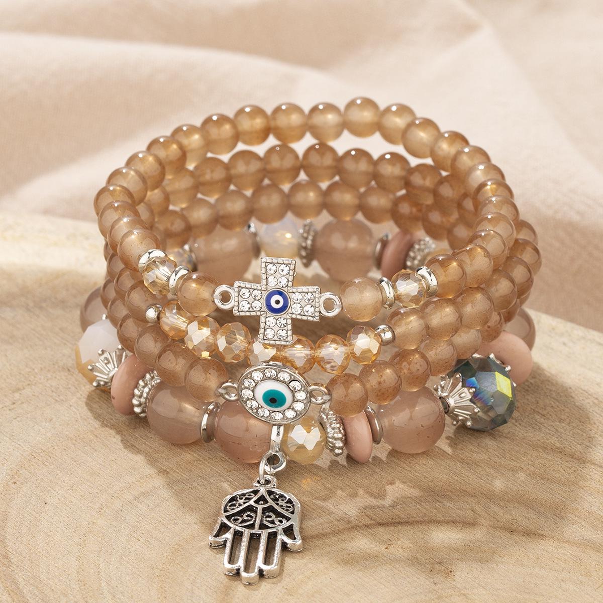 Bohemian Multi-layer Beaded Bracelet with Cross, Evil Eye, Palm Pendants, and Crystals.
