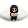Small Table Decorative Figure with Hooded Skull Character, Collector Shelf Piece for Desk Display and Themed Styling