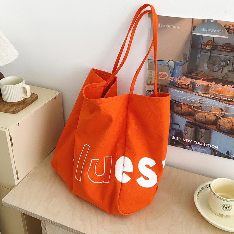 

Literary and artistic large-capacity fashion canvas bag, summer new women s commuter tote bag, letter shoulder bag оранжевый