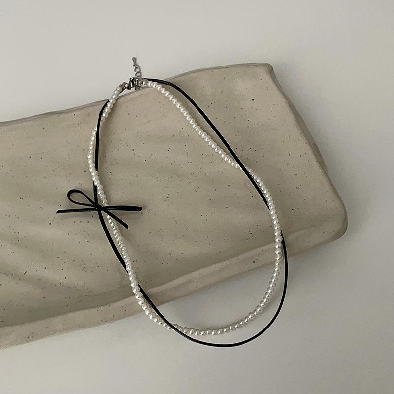 

Двойное кожаное жемчужное ожерелье-бантик, девичье чувство, милый и милый темперамент, универсальная личность, цепочка на шею, цепочка на ключицу