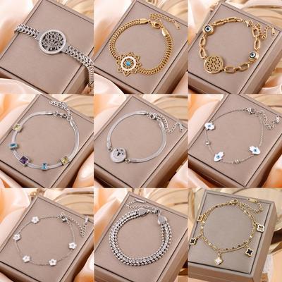 Bracciale Totem Vuoto in Oro 18K e Acciaio Titanio con Design Occhio e Quadrifoglio