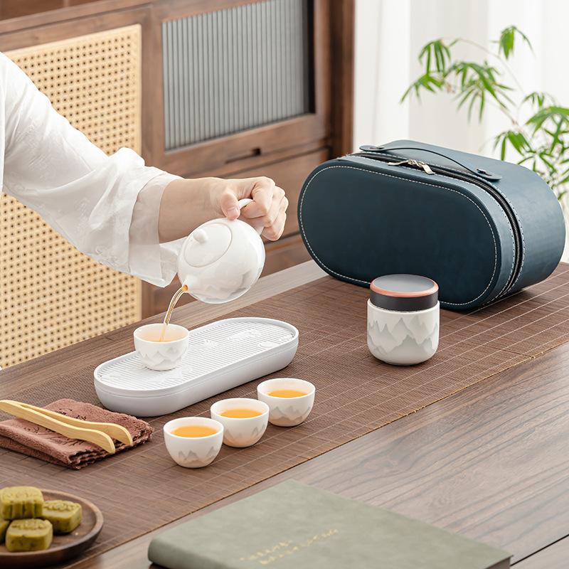 1011 New Travel Tea Set, Light Luxury and Portable, One Pot and Four Cups of Ru Kiln Car Express, Free Business Gifts