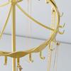 Iron Jewelry Display Stand with a Rotatable Upper Frame, Multiple Hanging Positions, and a Round Tray for Dresser Storage and Presentation
