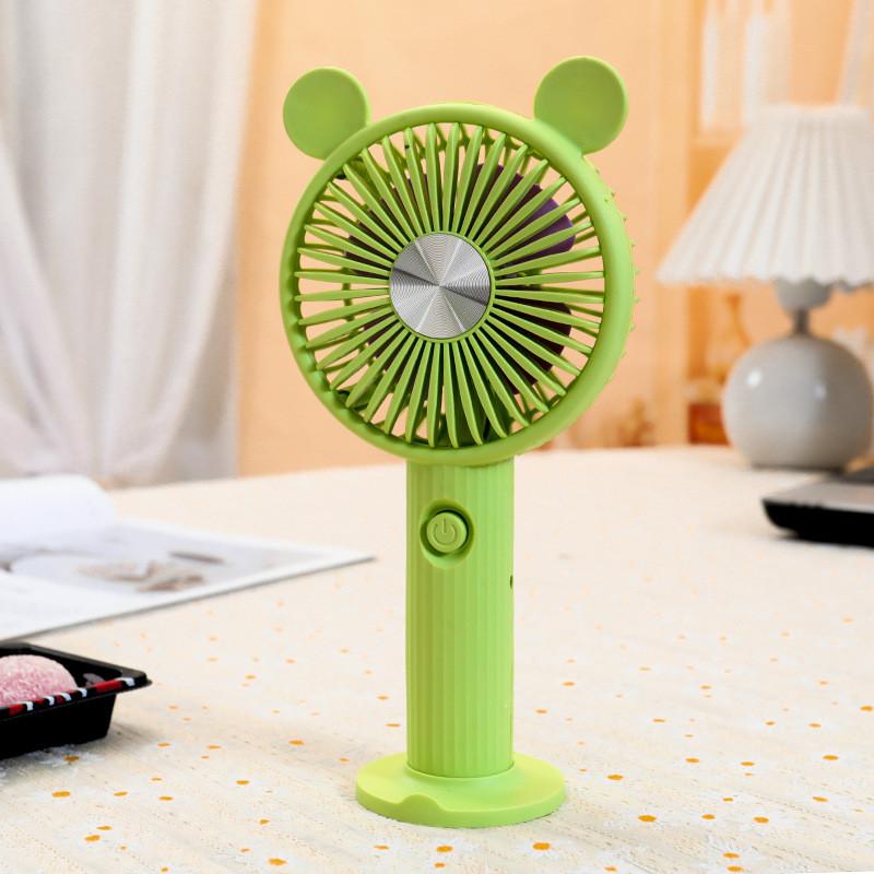 

Милий мультяшний вентилятор з круглими вушками, на міцній основі-підставці, ручний акумуляторний вентилятор з літієвою батареєю зелений