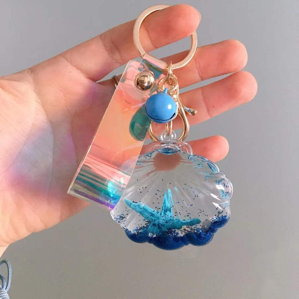 Akrylowy brelok w stylu koreańskim z rozgwiazdą i muszelką w ruchomym piasku oraz tęczowym laserowym skórzanym sznurkiem