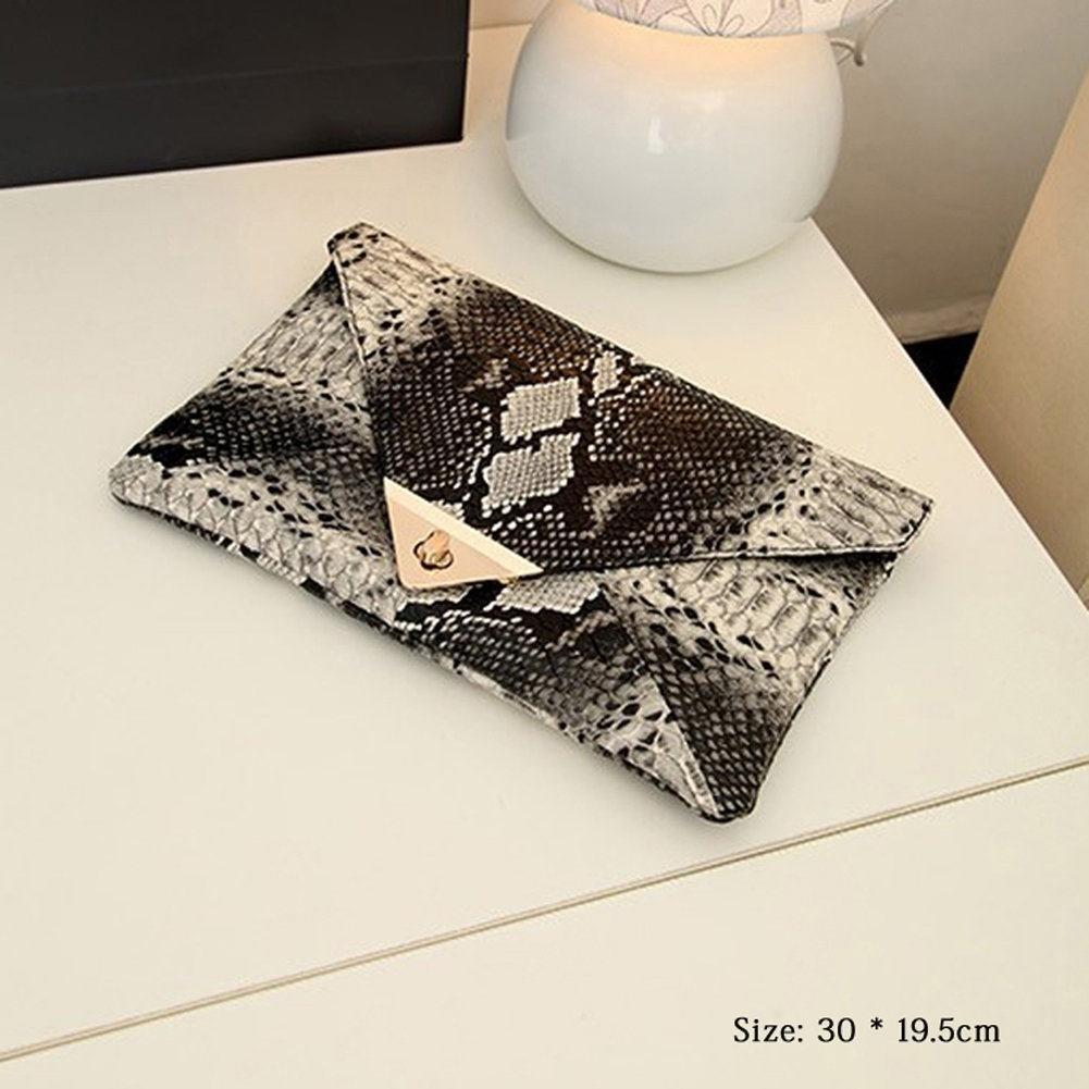 snakeskin envelope clutch