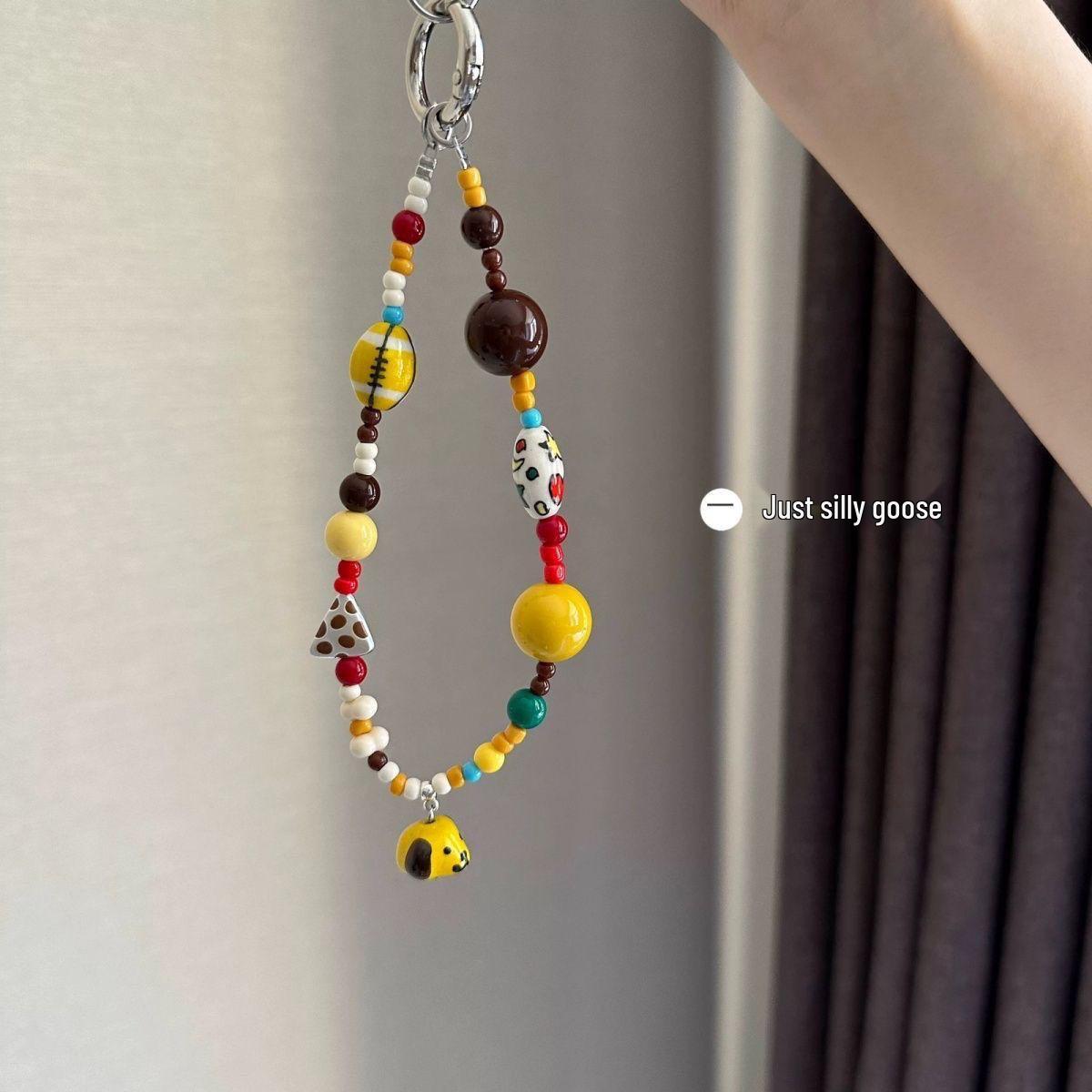 

Handmade Yellow Puppy Rugby Phone Charm: Beaded Lanyard Pendant