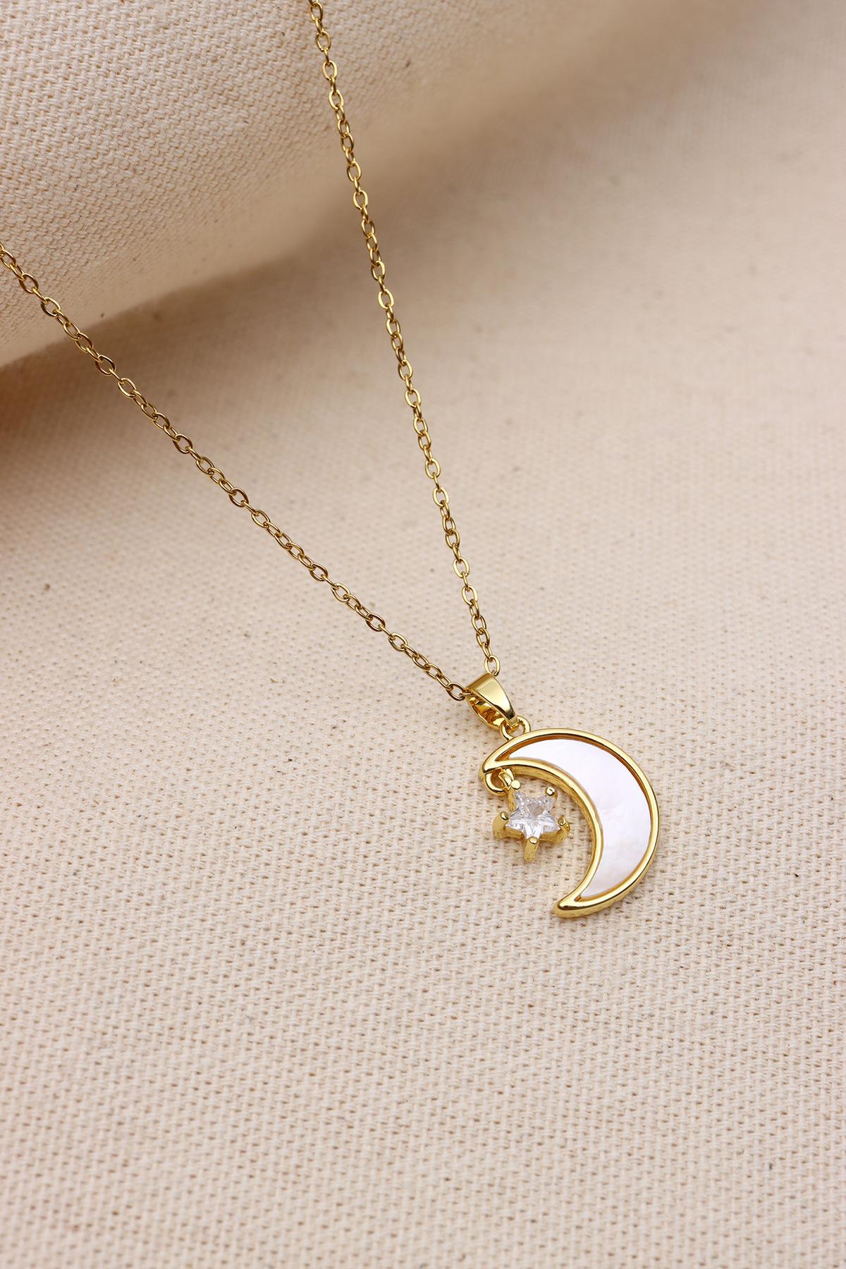 

Перламутровое ожерелье с изображением луны золотого цвета из стали