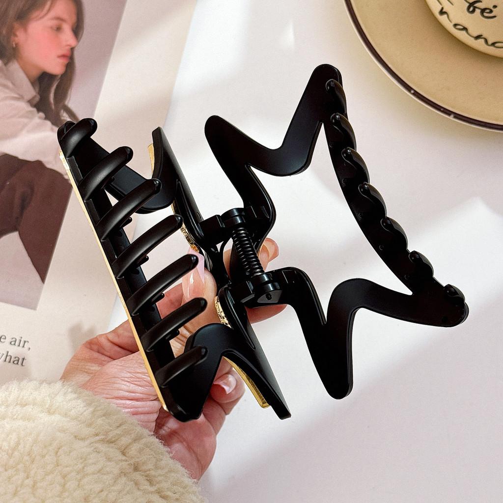 Elegant stjärnformad hårklämma för kvinnor med fantastiska strass i svarta och bruna toner