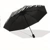 This Compact Umbrella Showcases a Striking Black And White Optical Illusion Design, Highlighted by a Large White Tiger in The