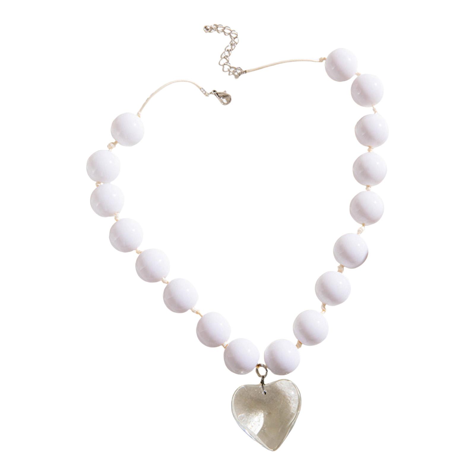 

Елегантне намисто з великим серцем, прикрашене бісером, символізує вічне кохання та вишуканість для молодих жінок, які стежать за модою.