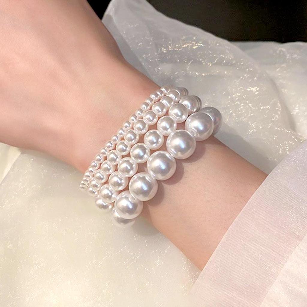 Elegant Multi-Piece Faux Pearl Bracelet for Women - Versatile, Elastic, and Stackable.