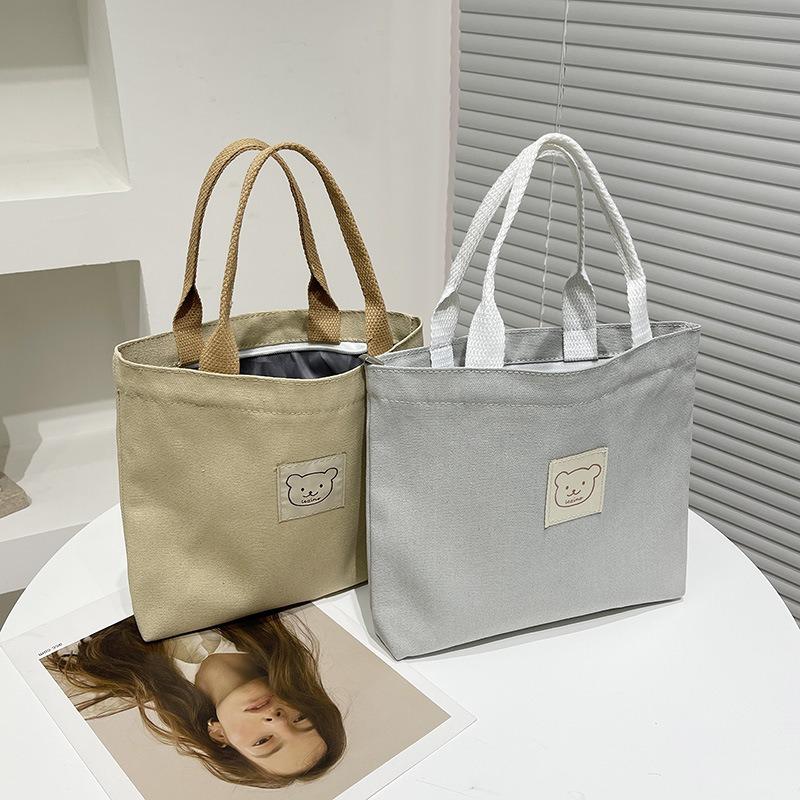 Women's bag niche design canvas tote bag hand carry bento bag mommy bag tote bag fashion trend canvas hand carry
