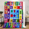 The pattern consists of letters, numbers, shapes, and corresponding images. for all seasons blanket lunch break throw gift