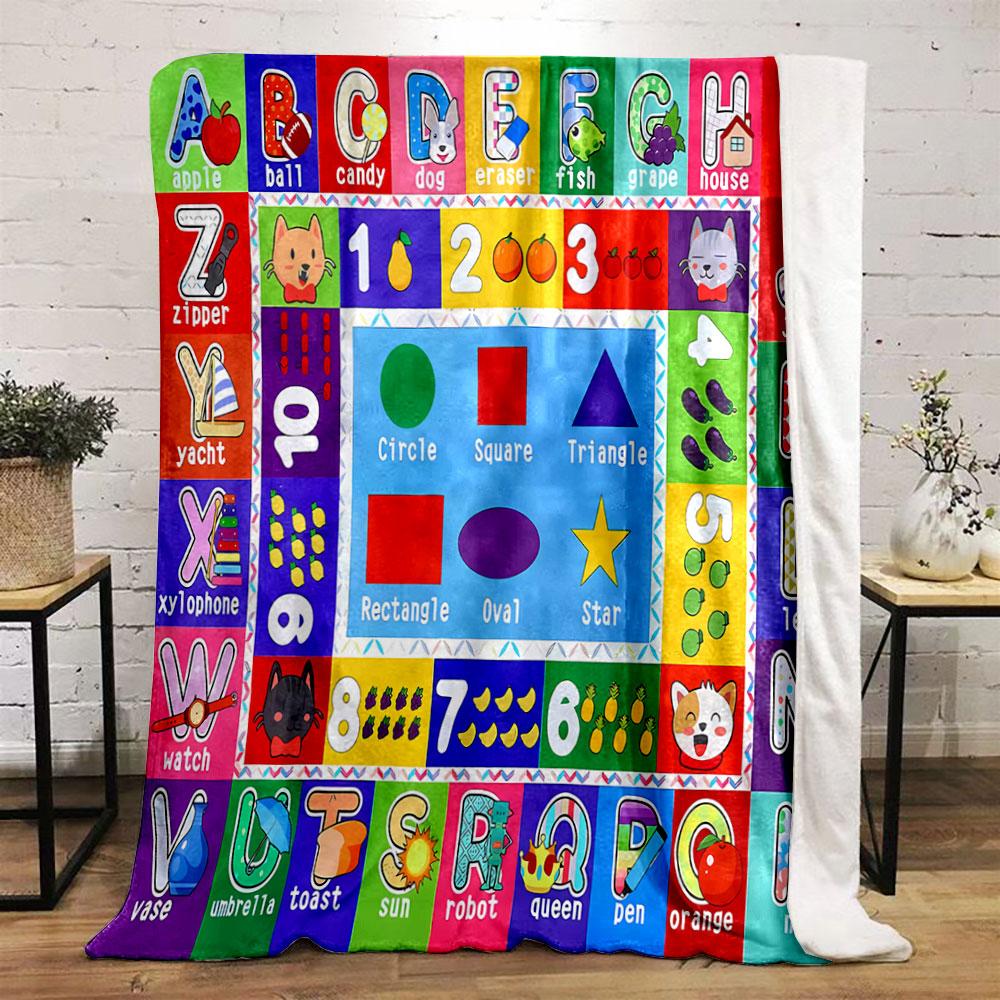 The pattern consists of letters, numbers, shapes, and corresponding images. for all seasons blanket lunch break throw gift