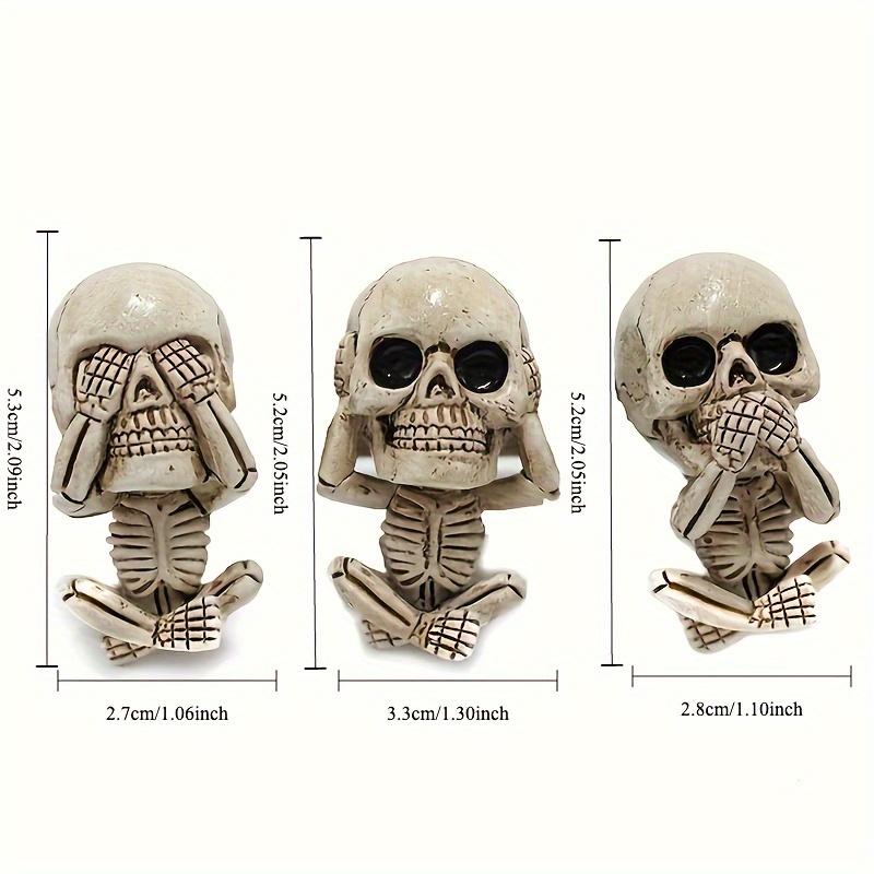 Creative car skull ornaments with the design of "see no evil, hear no evil, speak no evil", which are car interior decorations.