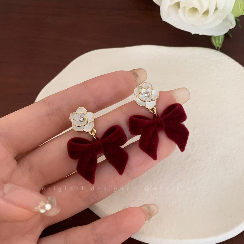 

Flocking bow camellia earrings women s autumn and winter new trendy temperament earrings niche design stud earrings