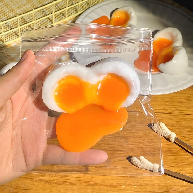 Die realistische, fließende Eierflüssigkeit mit haptischem Gefühl, ein süßes und entspannendes Knetspielzeug - Gel-Stressabbau-Spielzeug, mit einem süßen