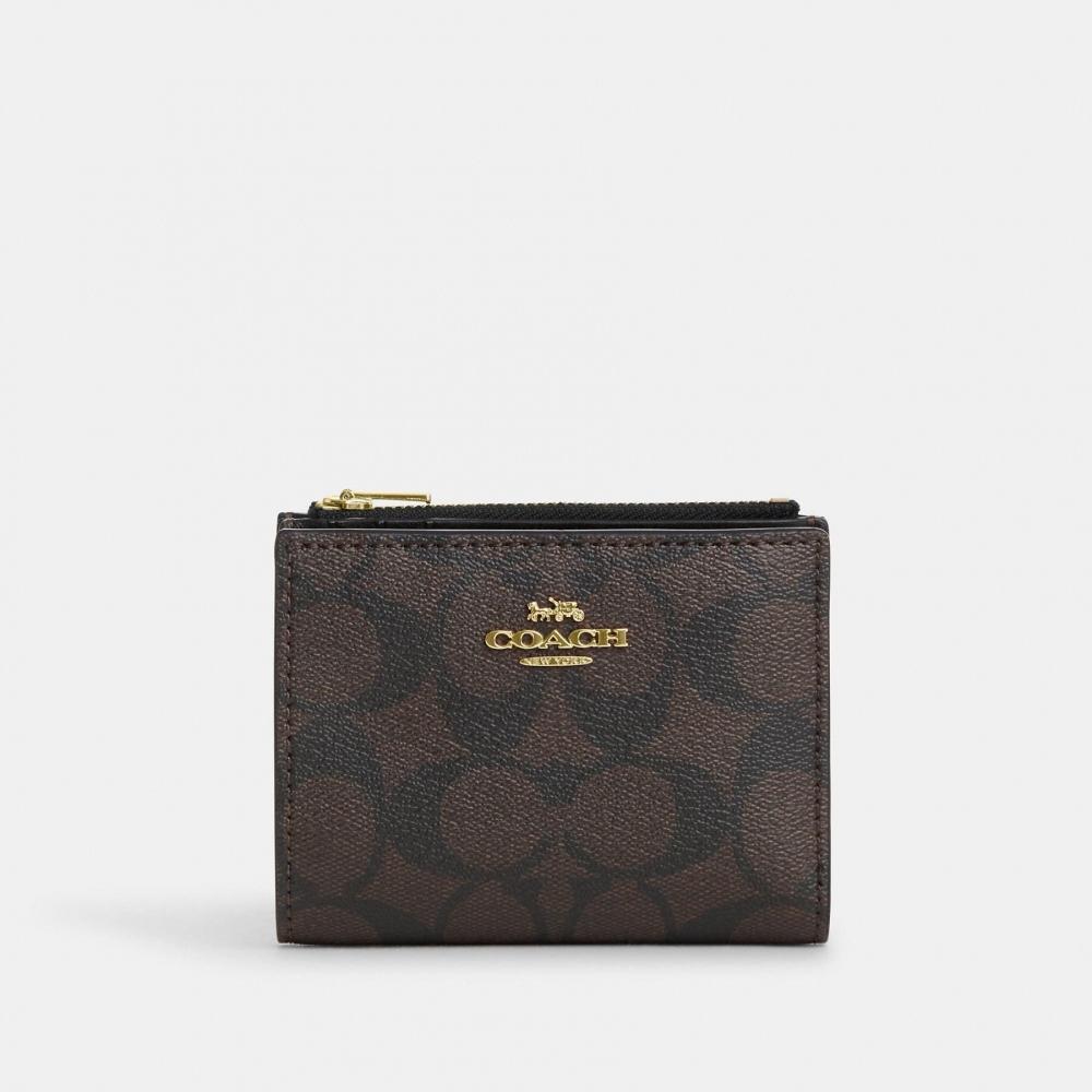 

Кошелек двойного сложения Coach из канвы Signature