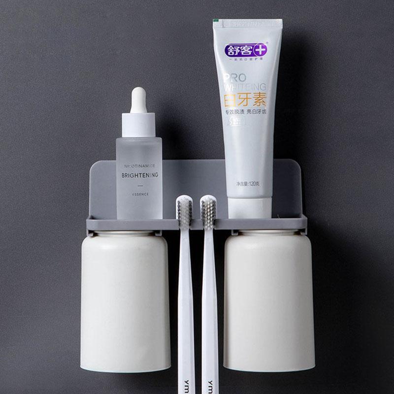 Badezimmerzubehör Wandmontierter Zahnbürstenhalter Doppelbecher Upside Down Toilettenzahnpasta-Aufbewahrungsregal Haushaltswaren