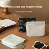 Compact Chinese-Style Spring Clip Storage Bag: Portable Lipstick, Coin, and Sanitary Napkin Holder