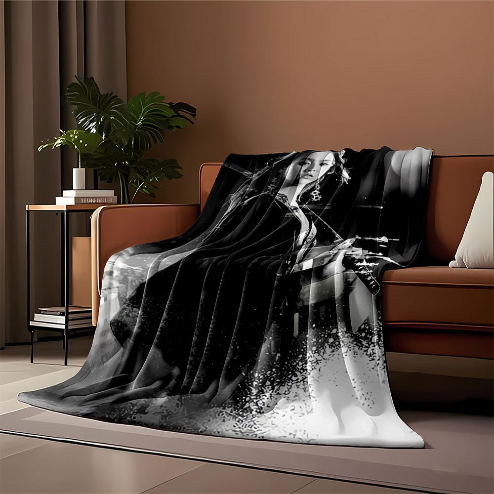 A woman holding a sword in a dynamic, monochromatic composition. for all seasons blanket lunch break throw gift