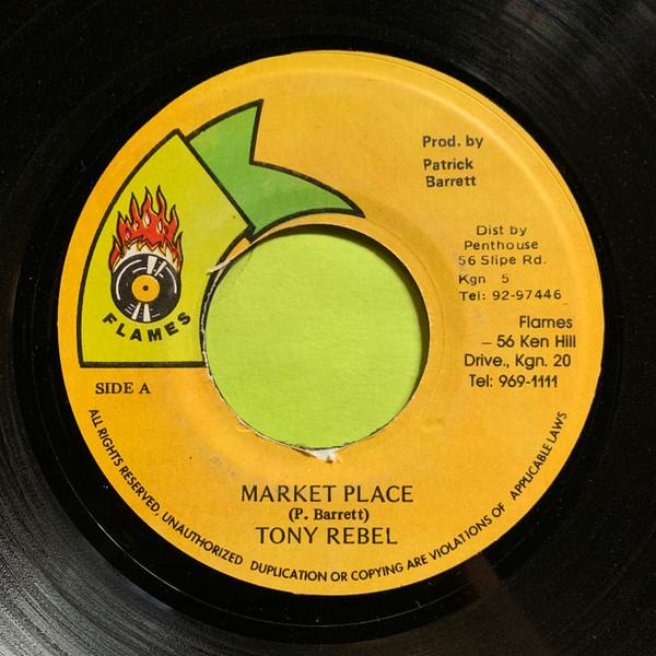 

7-дюймовая пластинка TONY REBEL - Market Place НЕТ Пламя Ямайка Регги, Ска и Даб Б/У