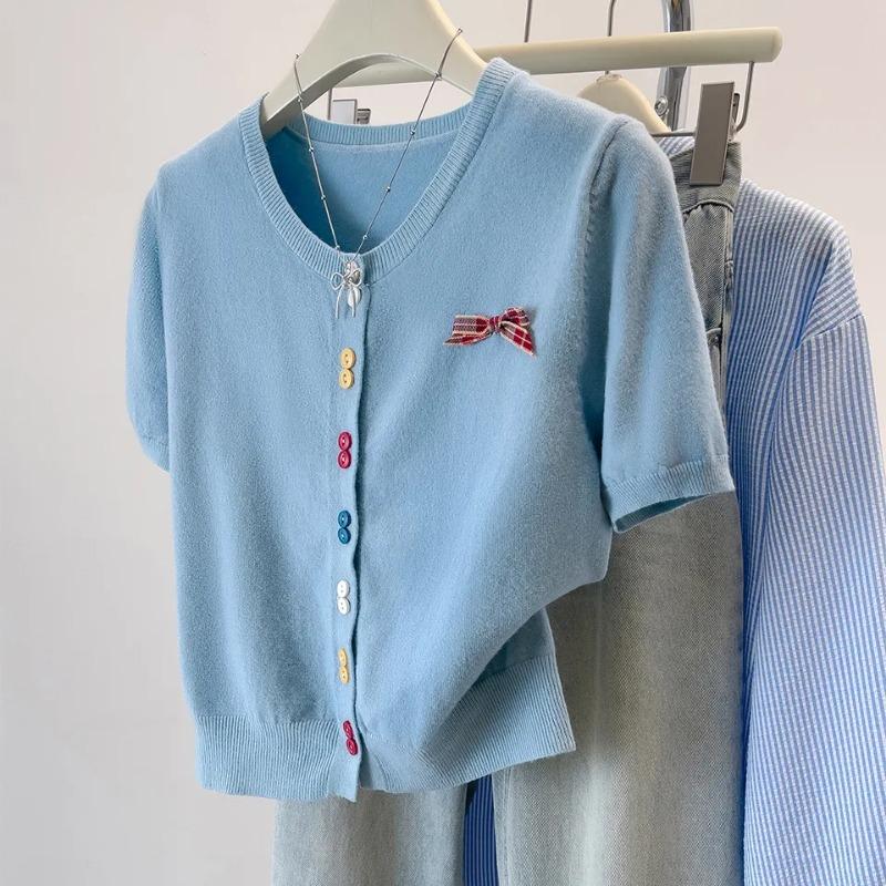 light blue v neck short sleeve knit cardigan with colorful buttons and bow detail for women S синий