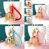 Elegant Pumpkin Car Charm Keychain Accessory For Women With Metallic Finish And Colorful Ropes Ideal For Gifts And Special Occasions