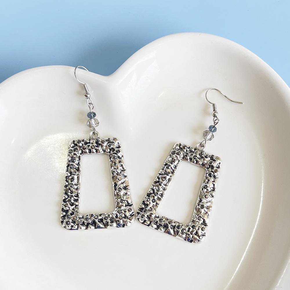 Retro Hollow Trapezoid Earrings with Irregular Polka Dot Pattern