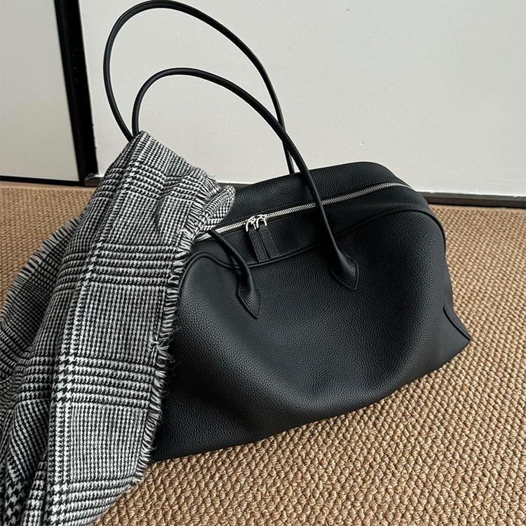 Schwarze weiche Leder-Tote-Bag mit großem Fassungsvermögen für Damen, leichter Luxus, Nische, High-End-Umhängetasche