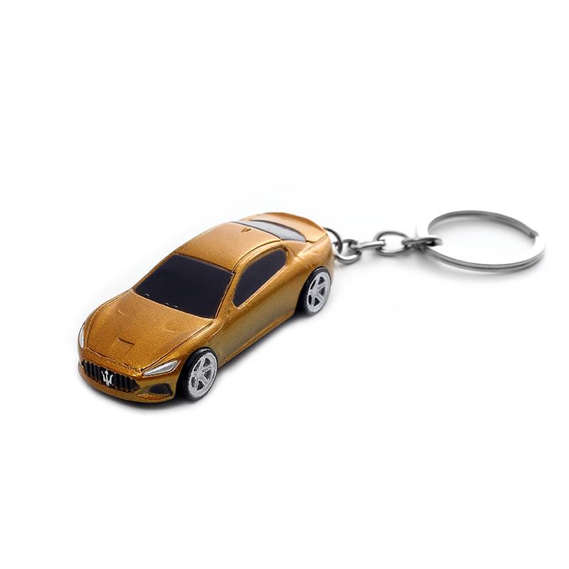 

«Хит продаж: игрушечная металлическая модель автомобиля и брелок для выживания»