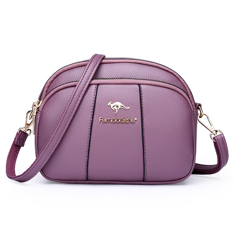

Soft leather three-layer anti-theft women s bag splicing lightweight shoulder women s bag messenger bag розовый