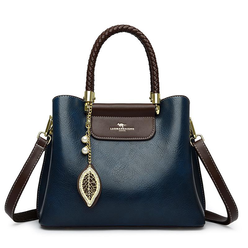 

Women s new women s new large-capacity portable women s mother shoulder messengerbag синій