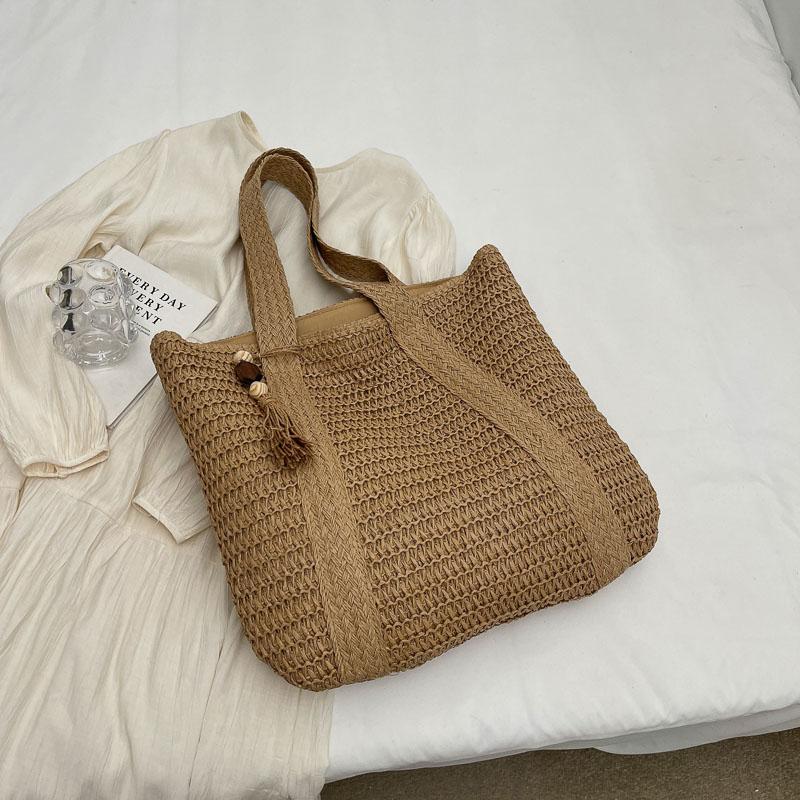 Handwoven Straw Tote Bag Women's Summer Beach Bag with Tassel Detail and Lightweight Design