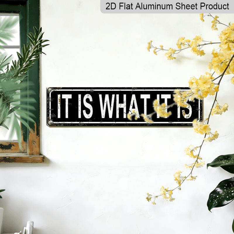 Metal Sign Featuring The Phrase 'IT IS WHAT IT IS' In A Rustic Style, Perfect for Vintage Wall Art In Your for Home, Garage, or Man Cave. This