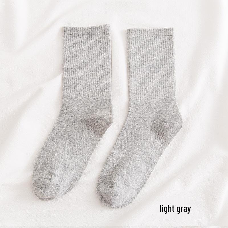 Women's Mid-Calf Cotton Socks - Solid Color, High Elasticity, Versatile Bubble Style for Autumn and Winter.