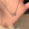 Nickel Silver Gold-Plated Bow Knot Necklace: Elegant Clavicle Chain with Luxurious Niche Design for Women
